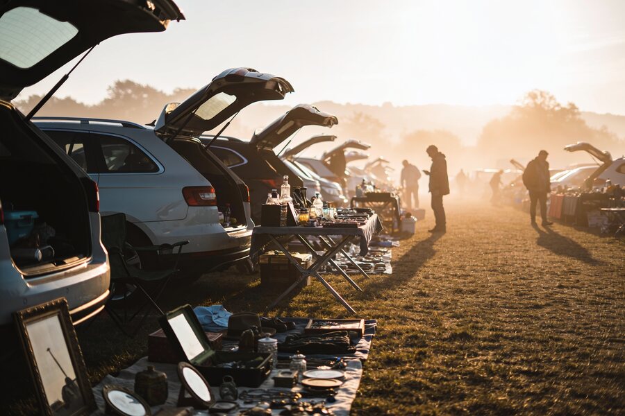 Early morning car boot sale with rows of stalls